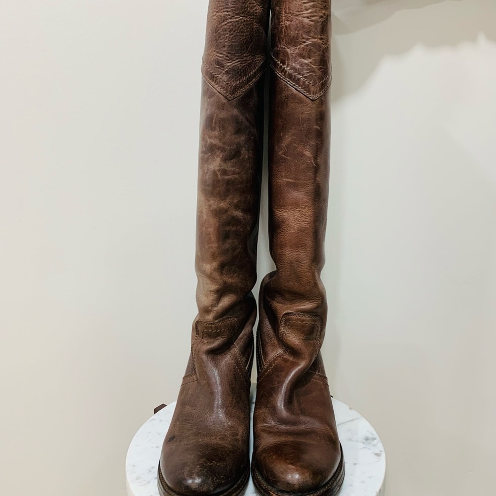 Frye over-the-knee distressed leather boots.